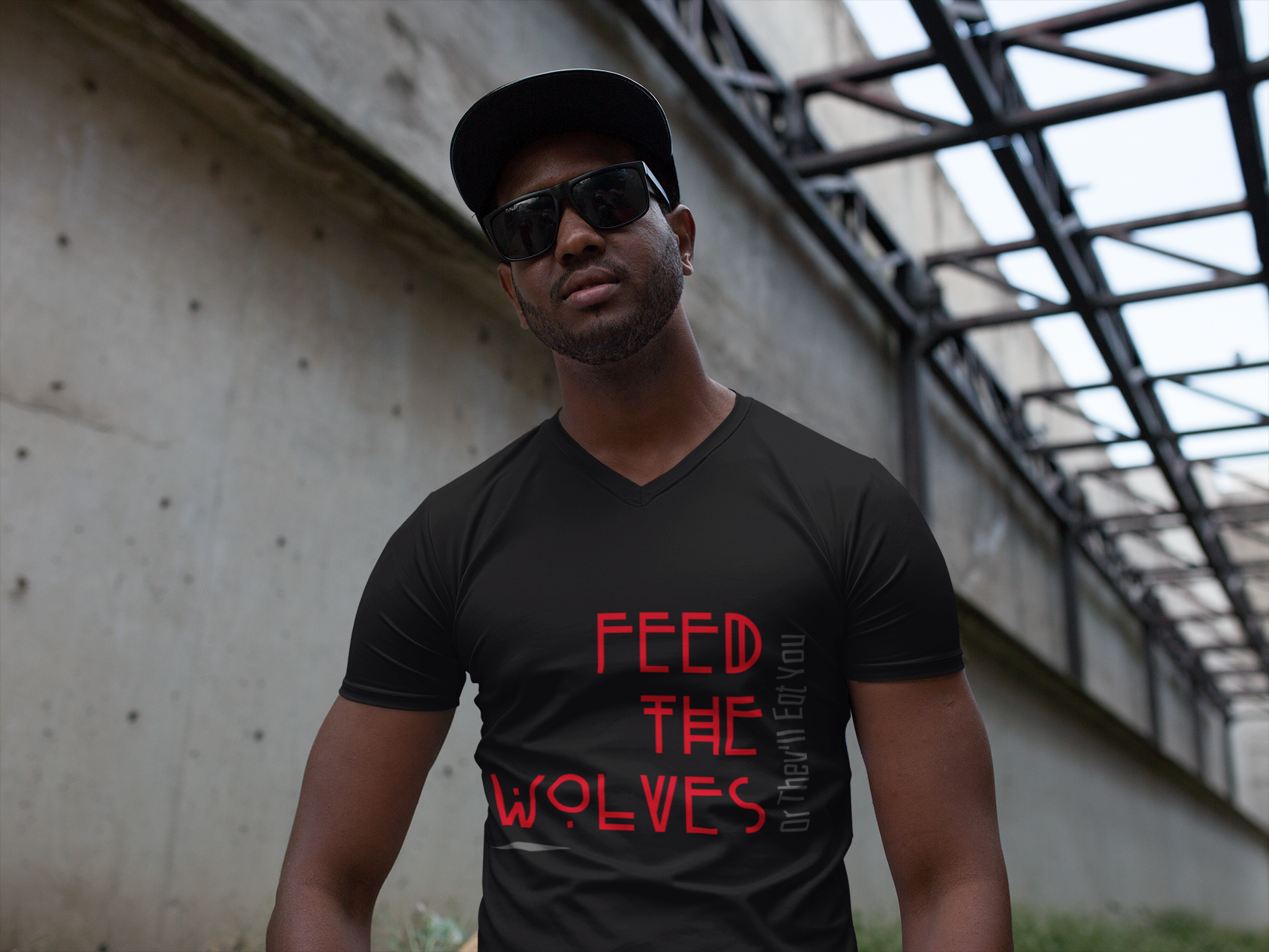 Male model wearing black signature t-shirt featuring ‘No Huddle Just Go’ Feed the Wolves design, a premium essential for any wardrobe.